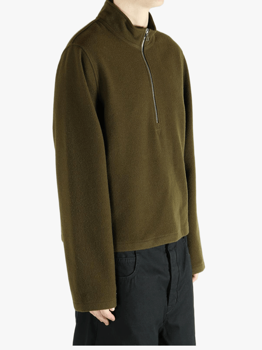 Brown sweater worn by a person, showing the sweater fit