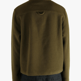 Brown sweater worn by a person, showing the sweater fit