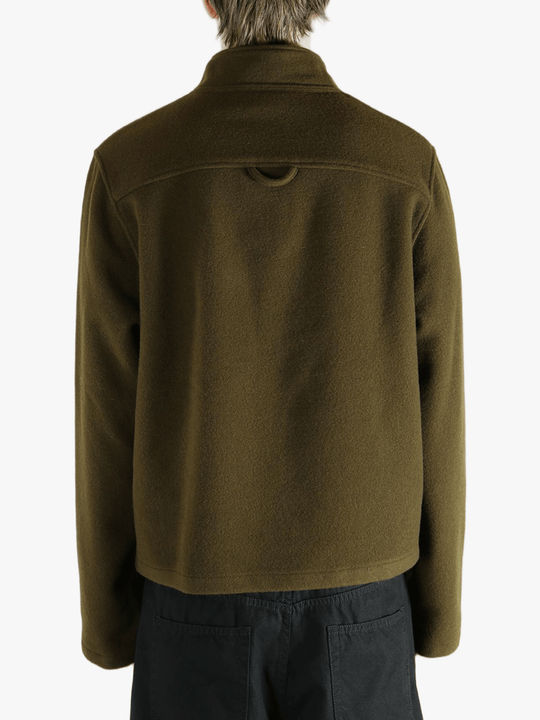 Brown sweater worn by a person, showing the sweater fit