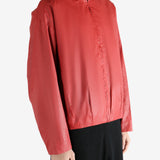 Red jacket worn by a person, showing the jacket's fit