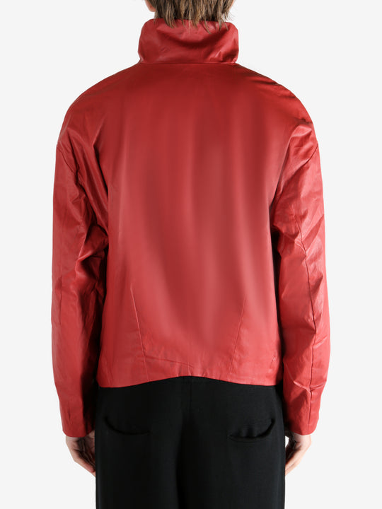 Red jacket worn by a person, showing the jacket's fit