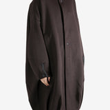 Brown jacket worn by a person, showing the jacket's fit