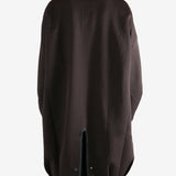 Brown jacket worn by a person, showing the jacket's fit