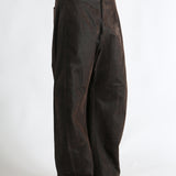 Brown pants worn by a person, showing the pants fit