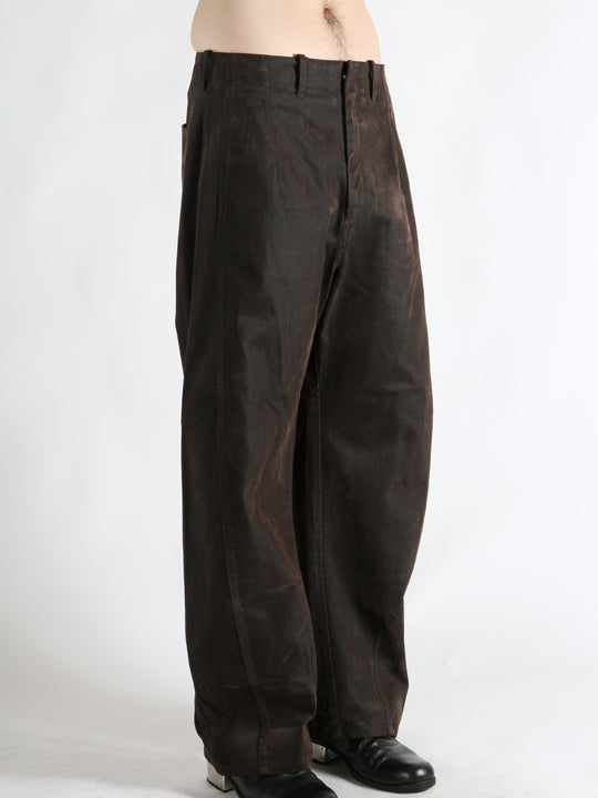 Brown pants worn by a person, showing the pants fit