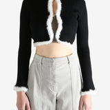 Black jacket worn by a person, showing the jecket's fit