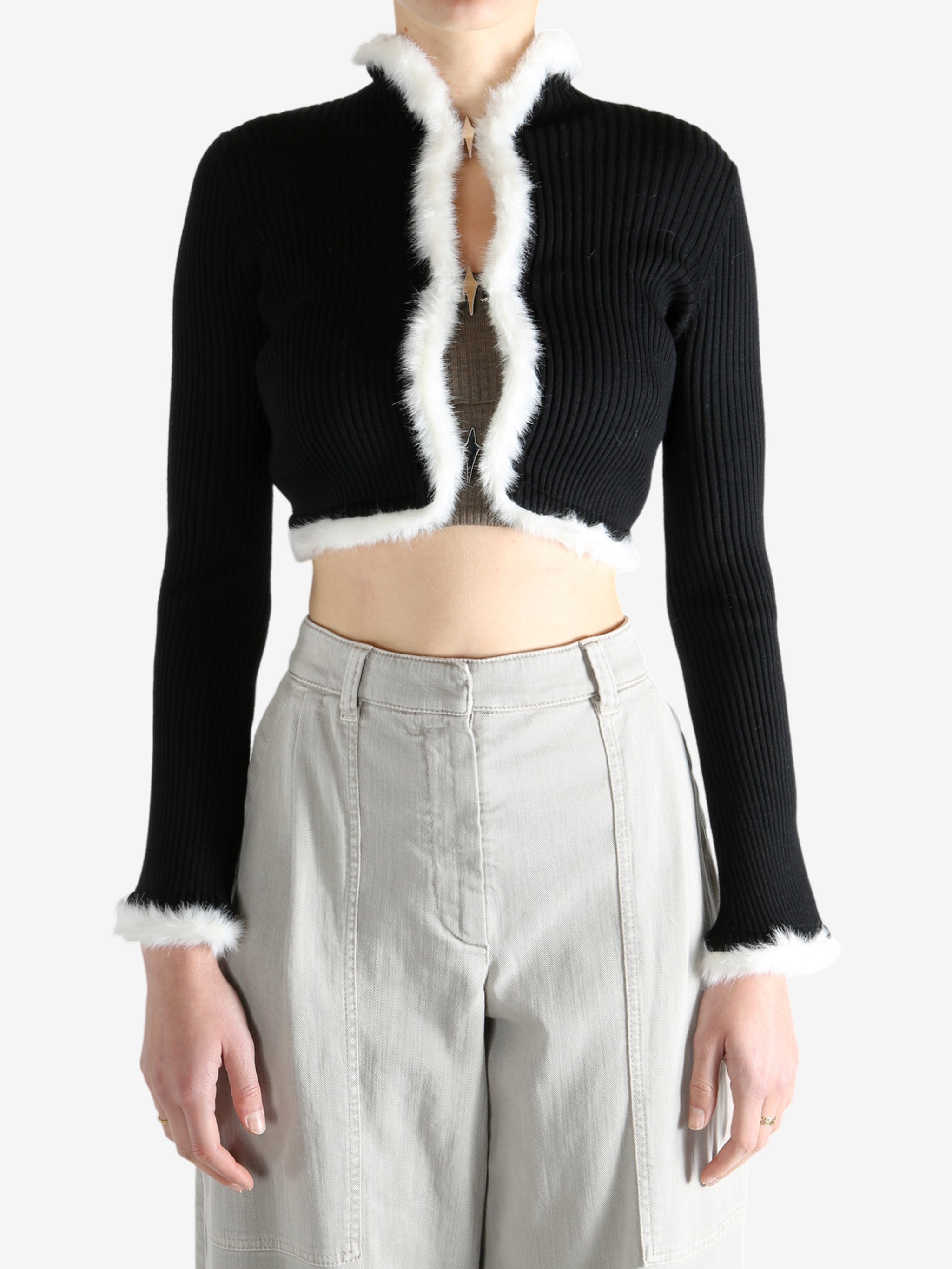 Black jacket worn by a person, showing the jecket's fit