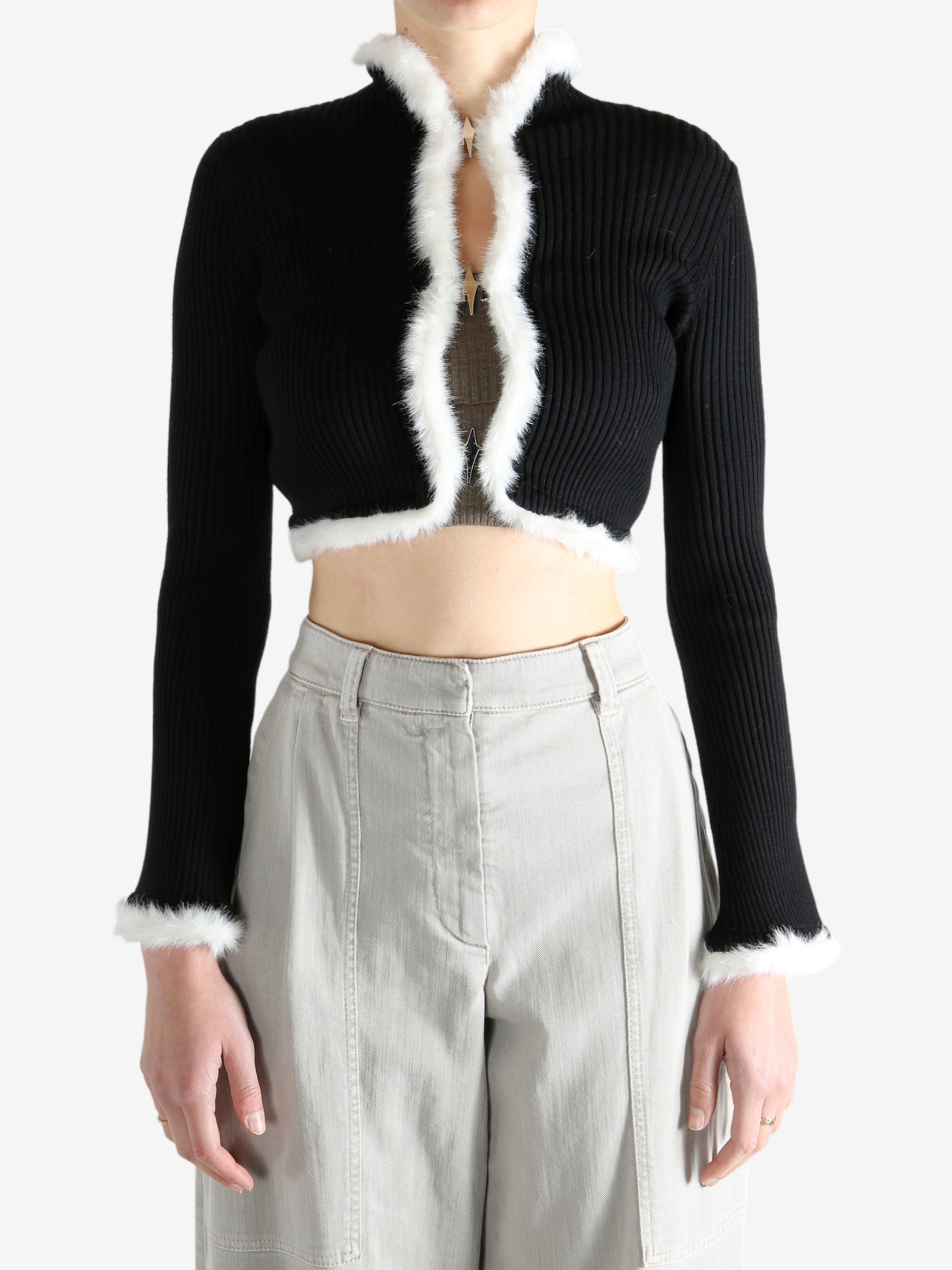 Black jacket worn by a person, showing the jecket's fit