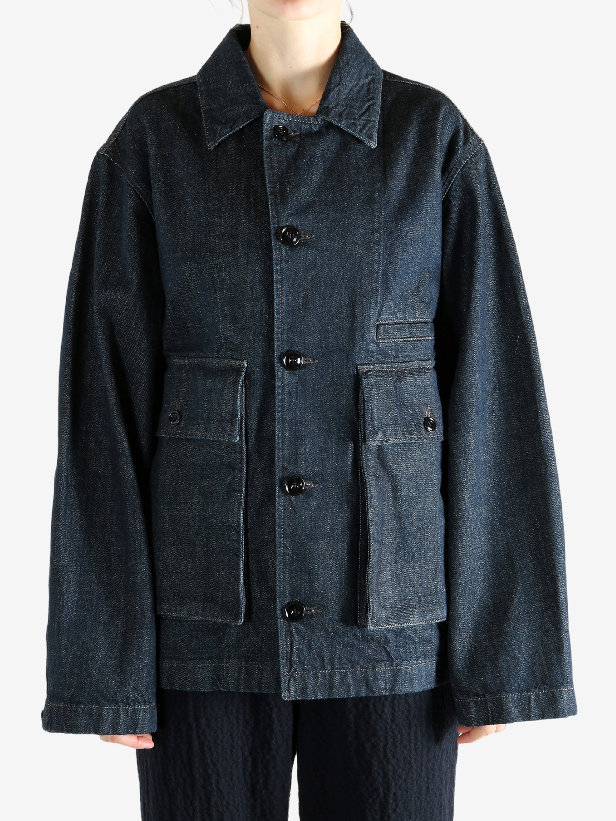 Blue jacket worn by a person, showing the jacket fit