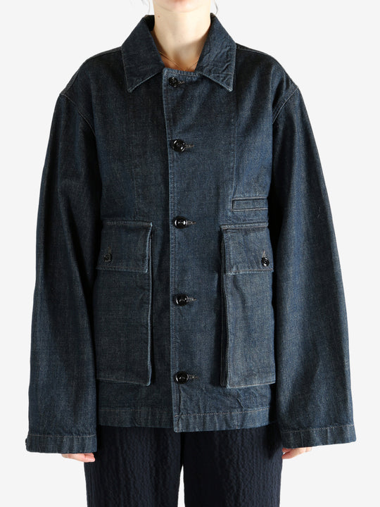 Blue jacket worn by a person, showing the jacket fit