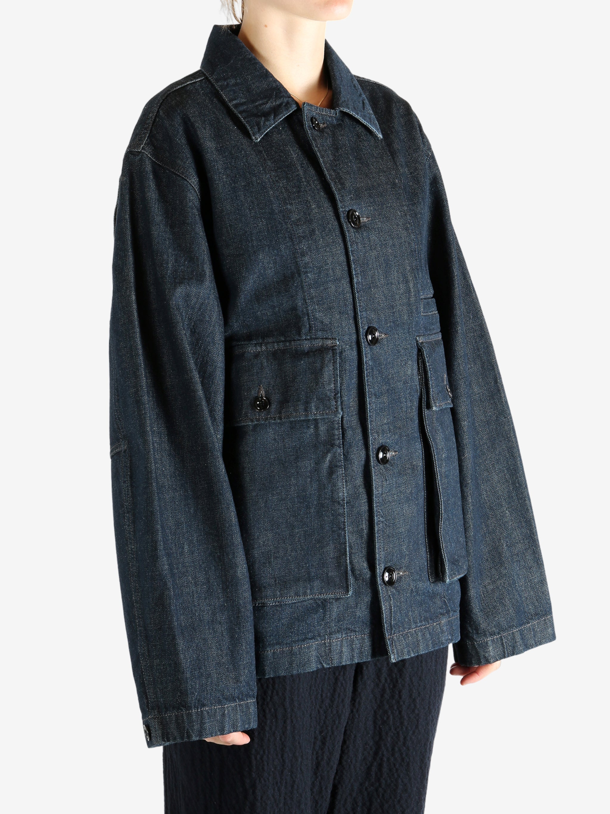 Blue jacket worn by a person, showing the jacket fit