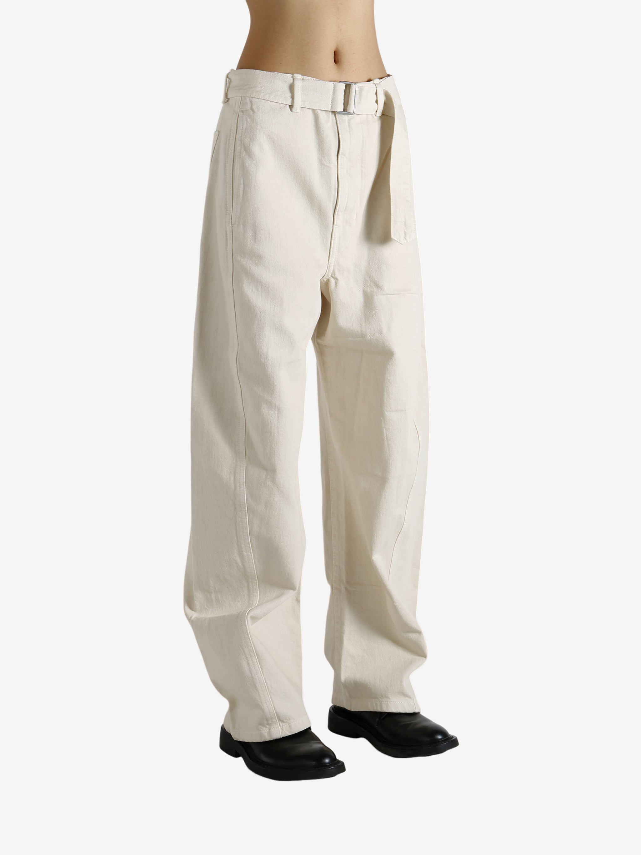 Tan pants worn by a person, showing the pants fit