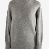 Grey sweater worn by a person, showing the sweater fit
