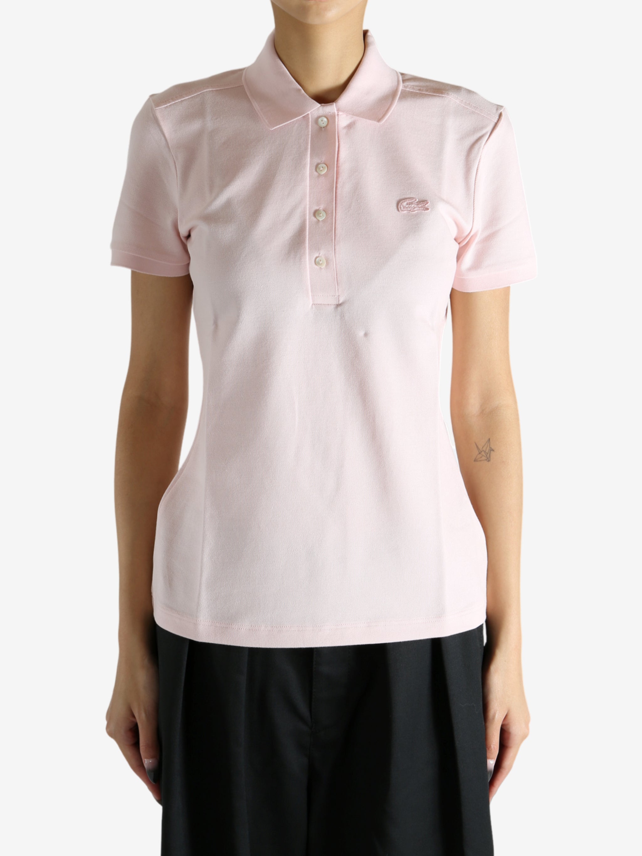 Pink shirt worn by a person, showing the shirt's fit