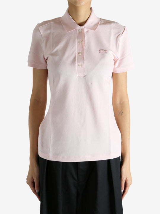 Pink shirt worn by a person, showing the shirt's fit