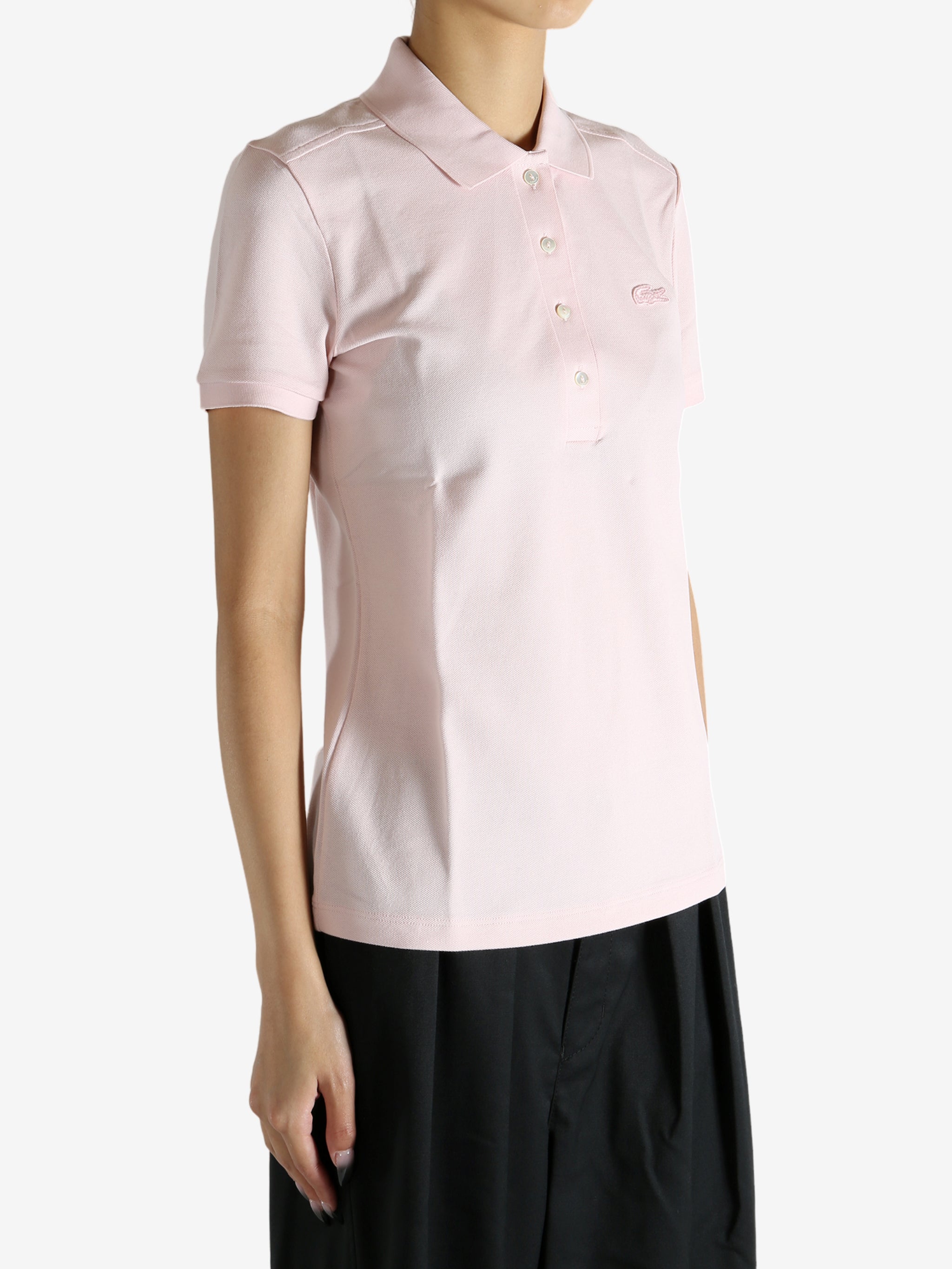 Pink shirt worn by a person, showing the shirt's fit