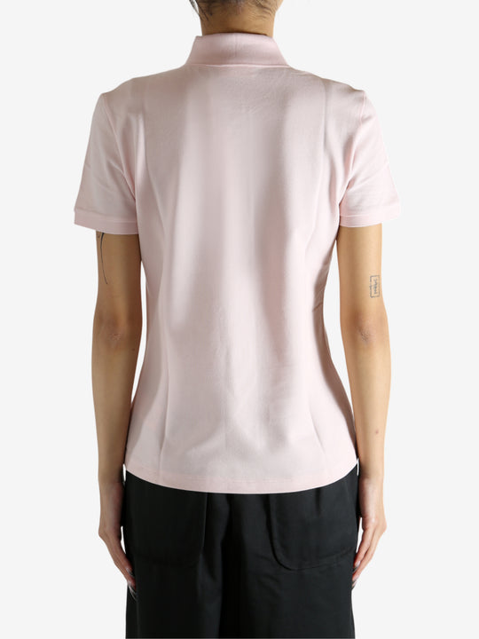 Pink shirt worn by a person, showing the shirt's fit