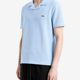 Blue shirt worn by a person, showing the shirt fit