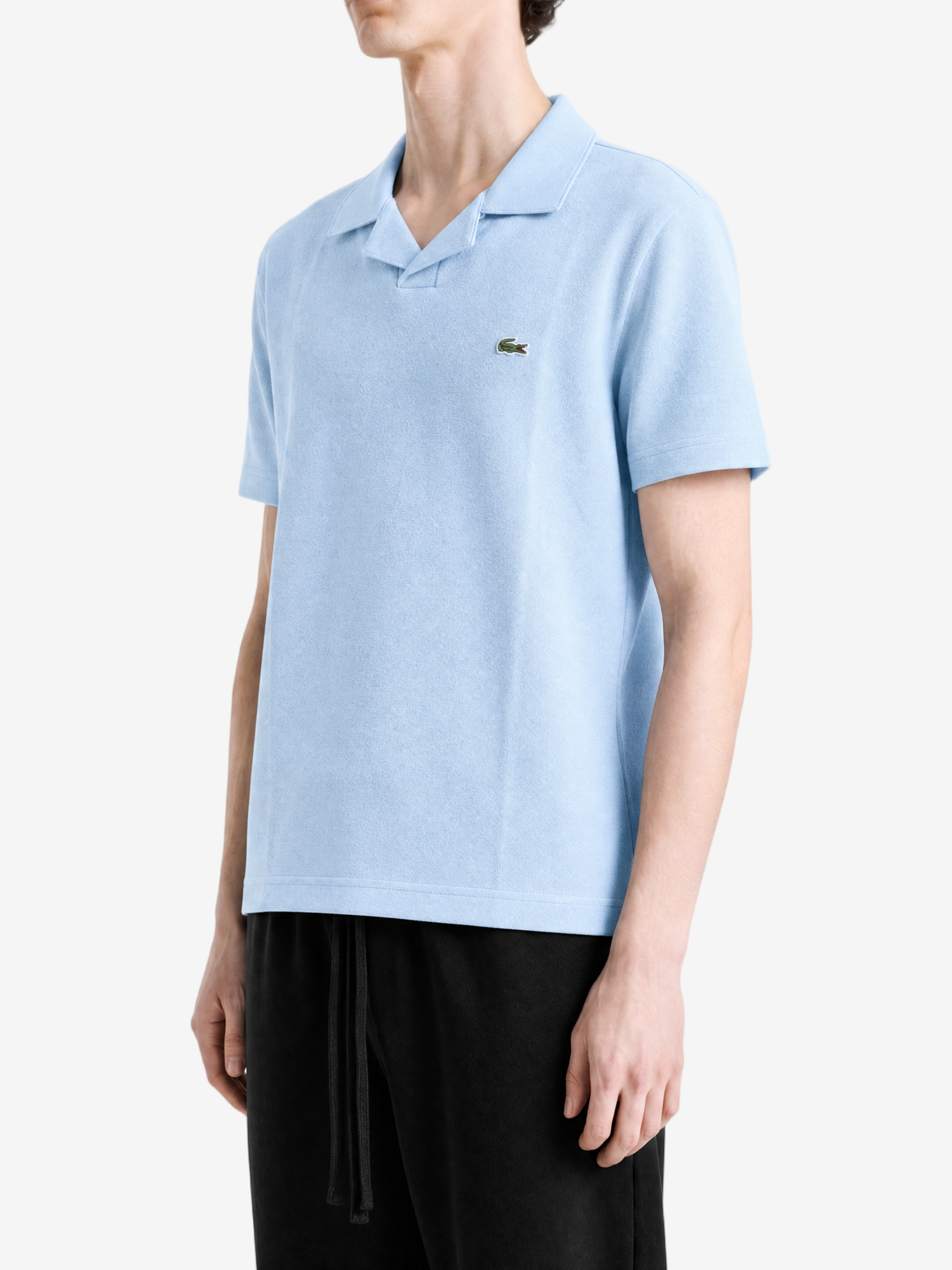 Blue shirt worn by a person, showing the shirt fit