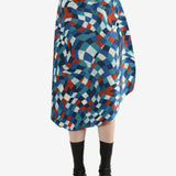 Blue skirts worn by a person, showing the skirt's fit