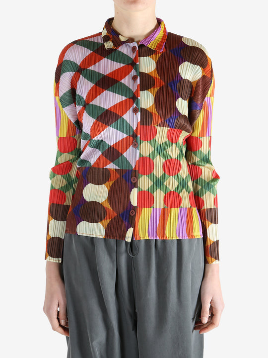 Pink shirt worn by a person, showing the shirt fit