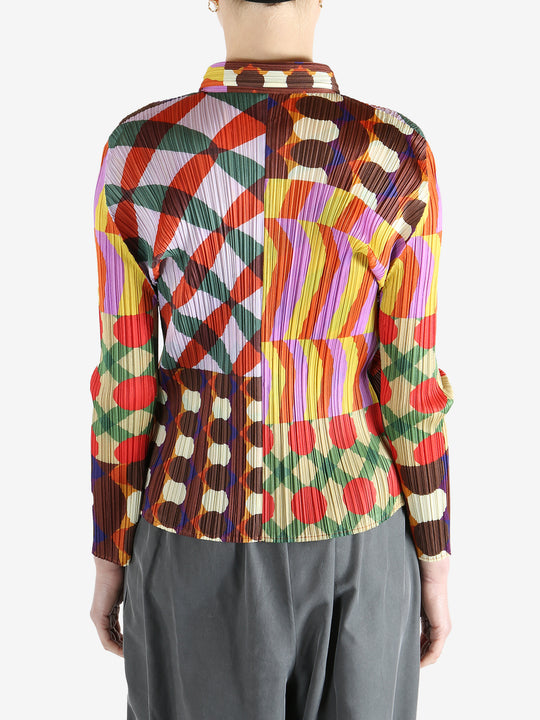 Pink shirt worn by a person, showing the shirt fit