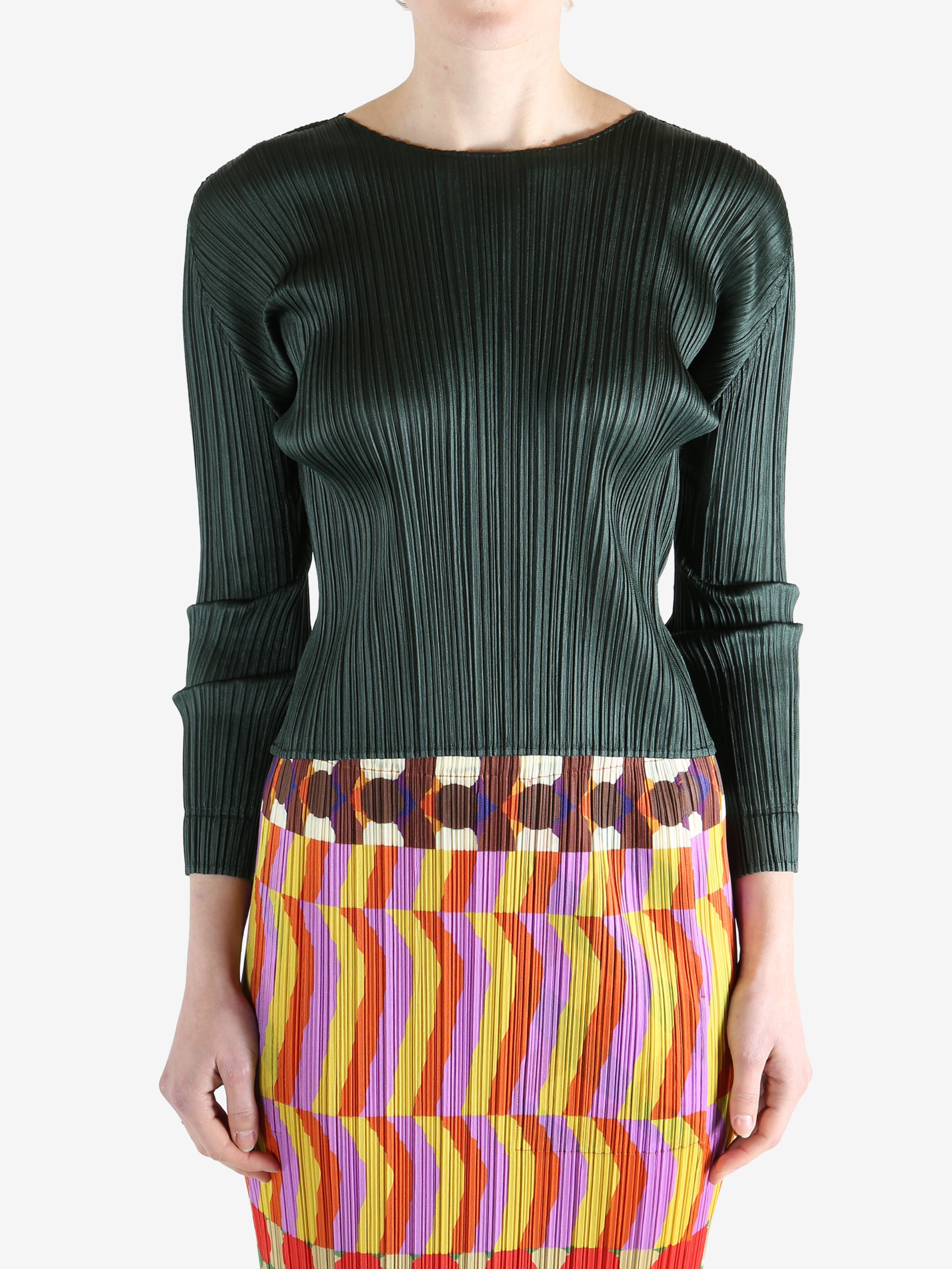 green ribbed sweater worn by a person, showing the sweater fit