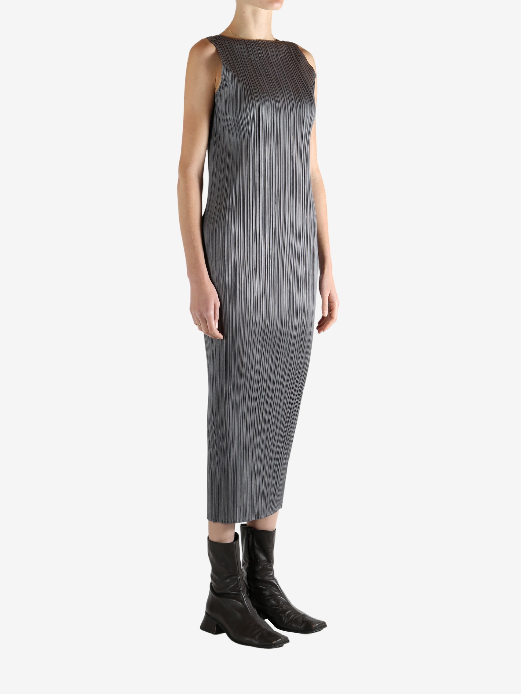 Grey dress worn by a person, showing the dress's fit