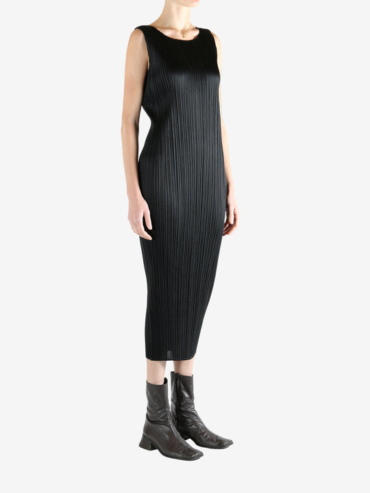 Grey dress worn by a person, showing the dress's fit