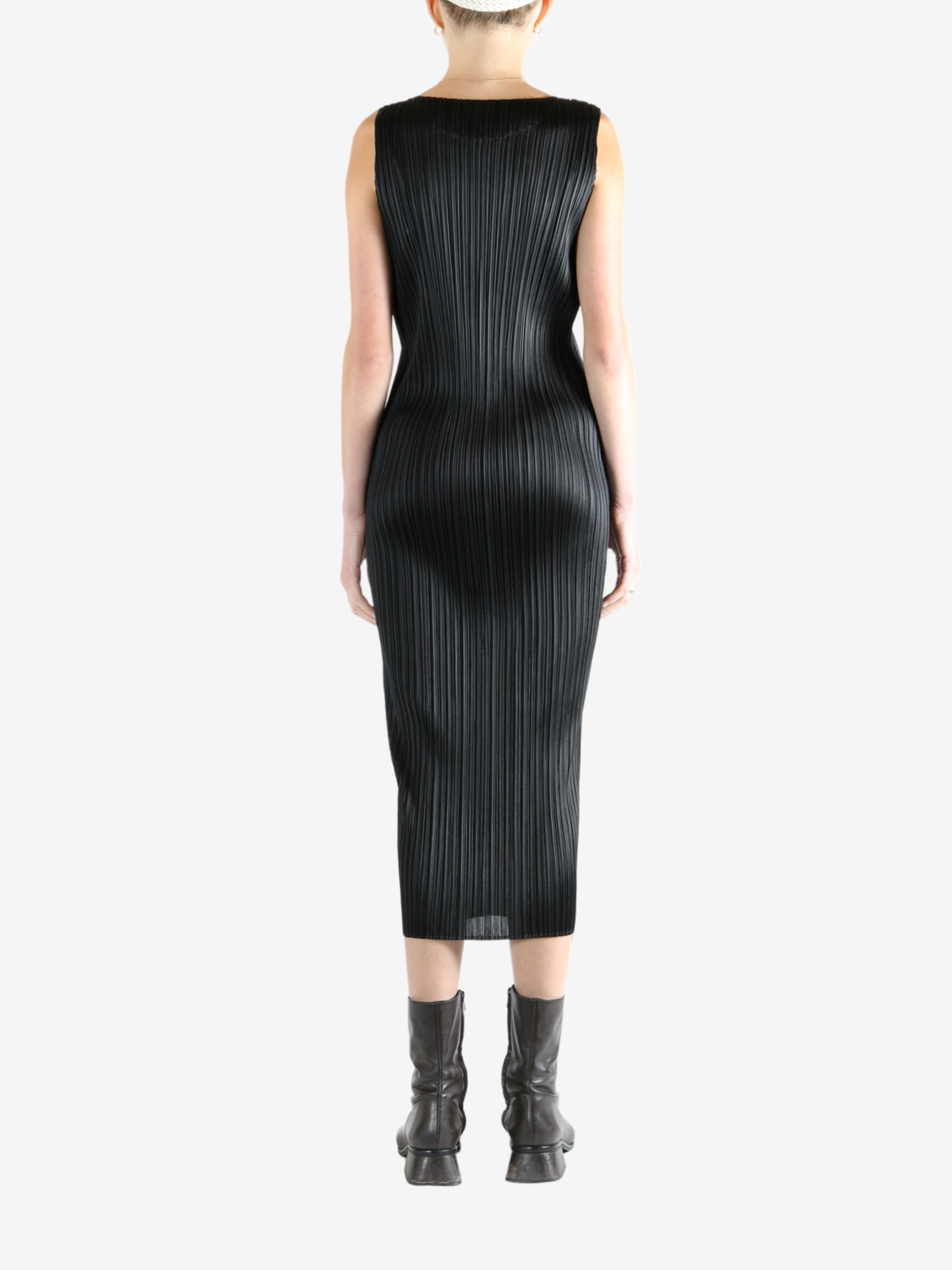 Grey dress worn by a person, showing the dress's fit