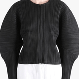 Black jacket worn by a person, showing the jacket fit