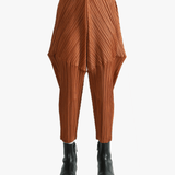 Brown pants worn by a person, showing the pants's fit