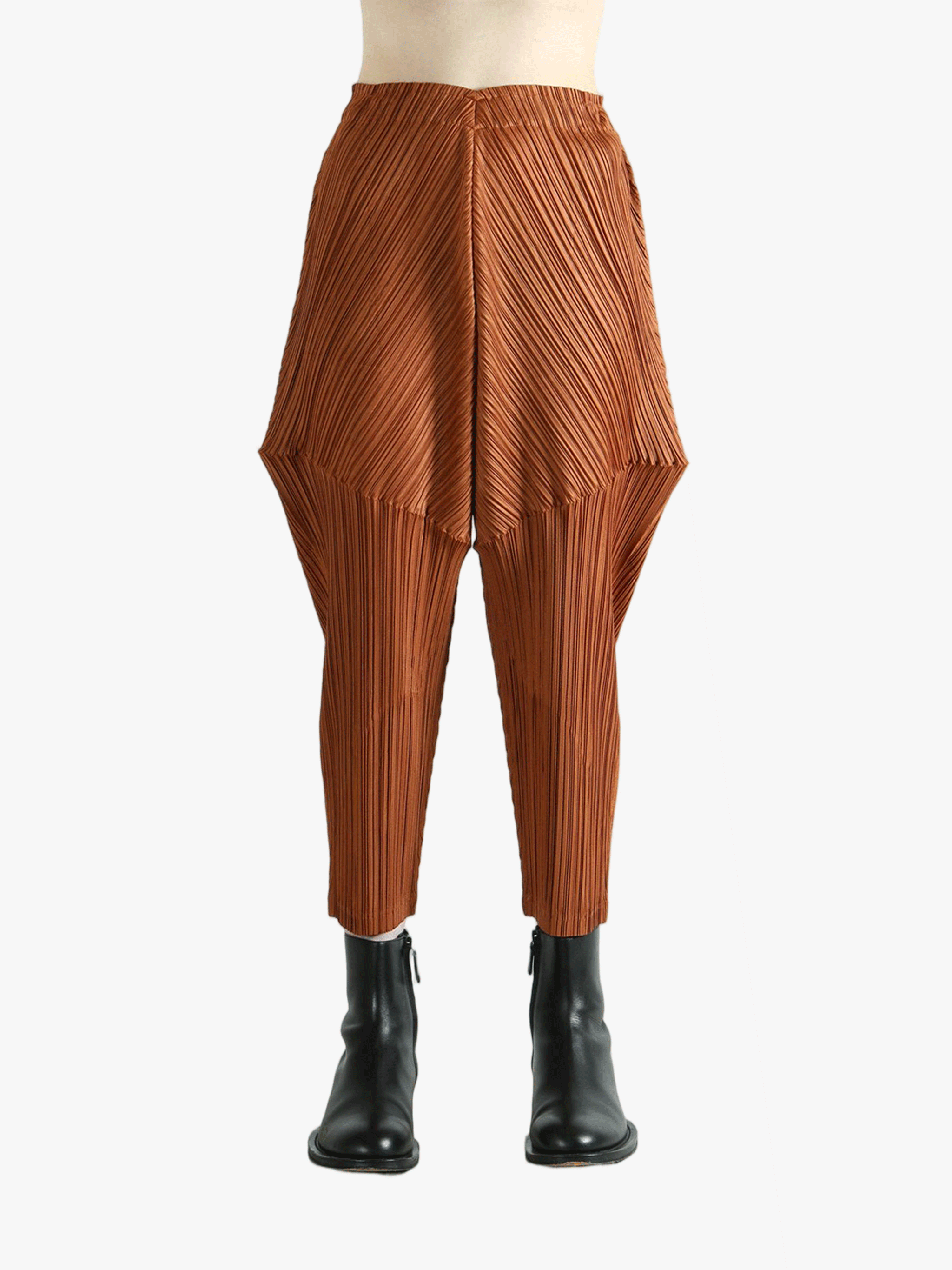 Brown pants worn by a person, showing the pants's fit