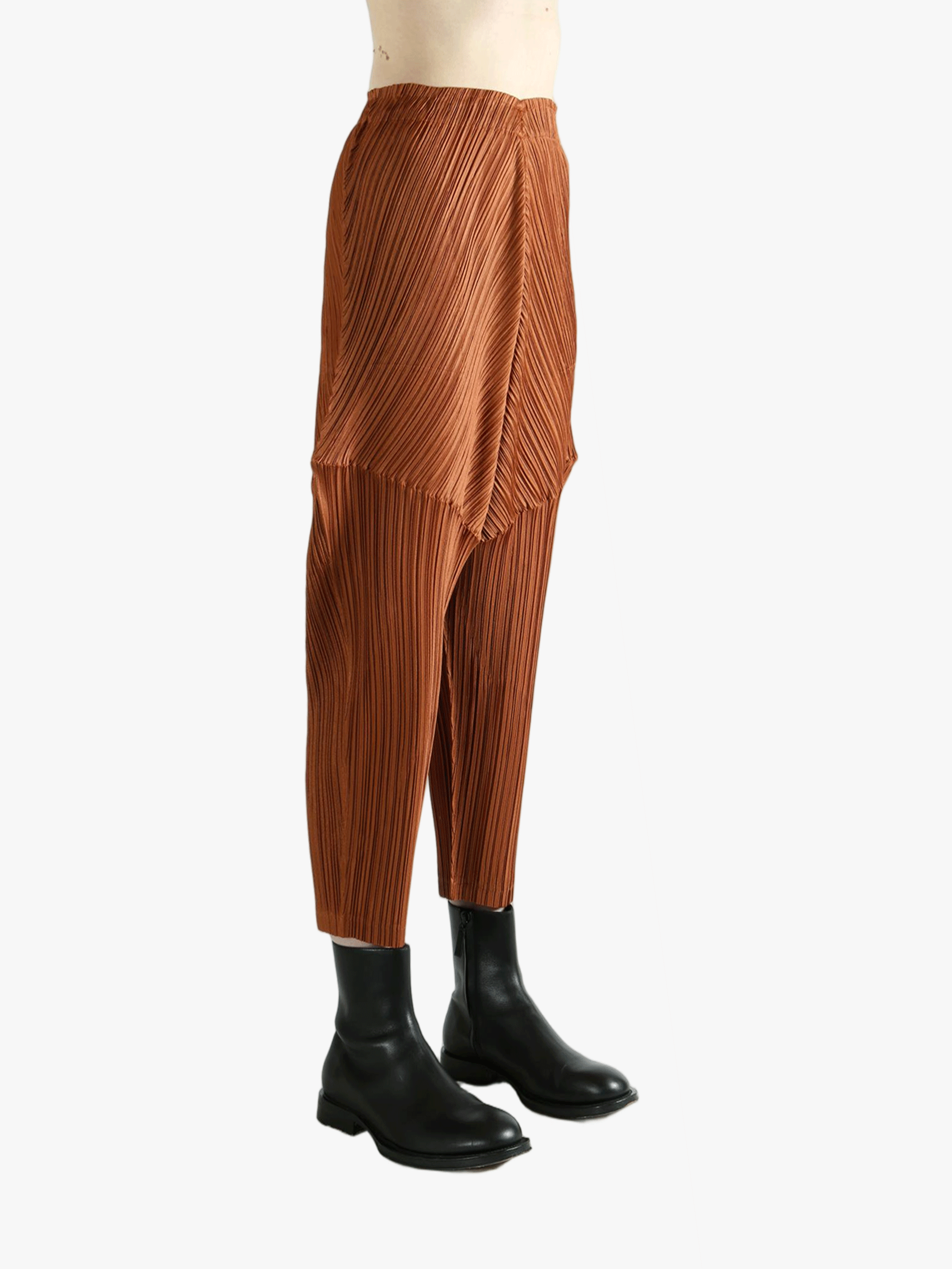 Brown pants worn by a person, showing the pants's fit