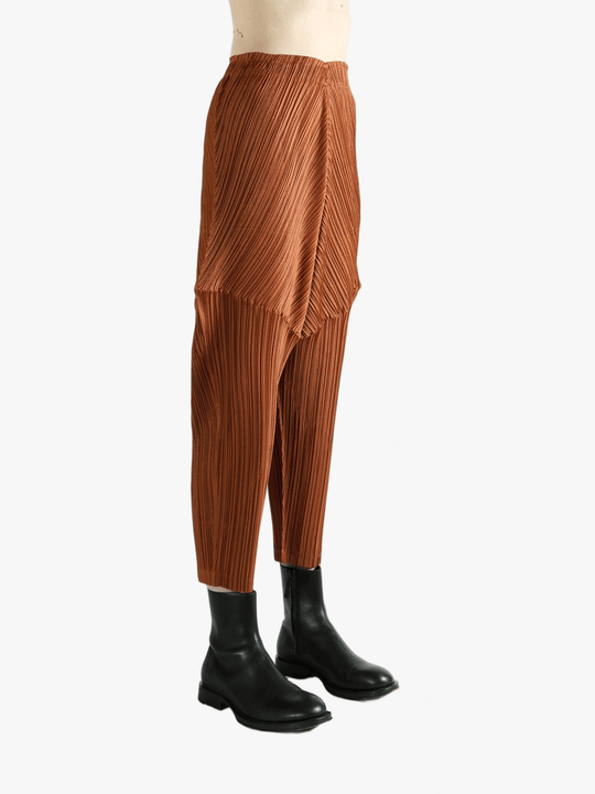 Brown pants worn by a person, showing the pants's fit