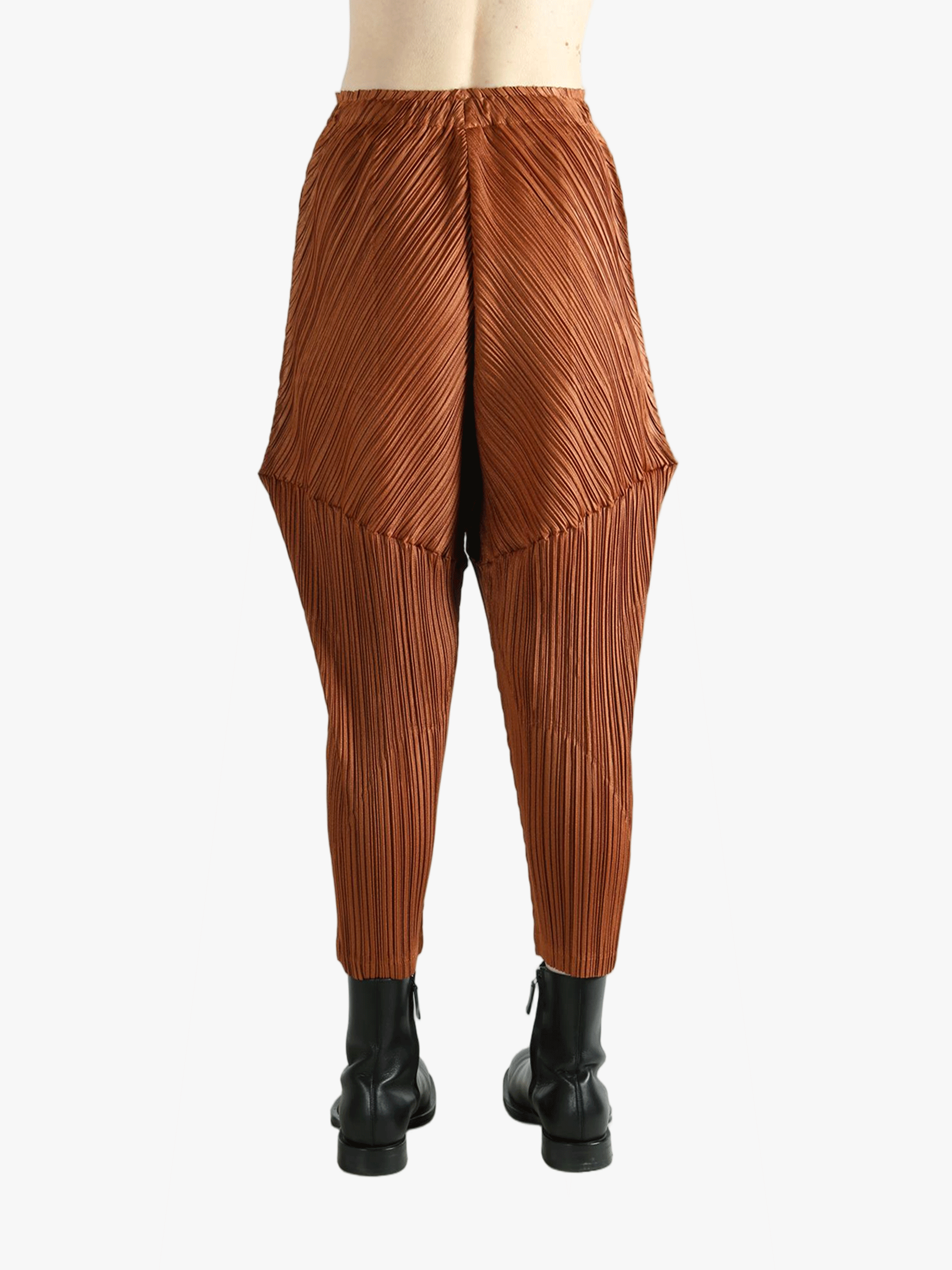 Brown pants worn by a person, showing the pants's fit