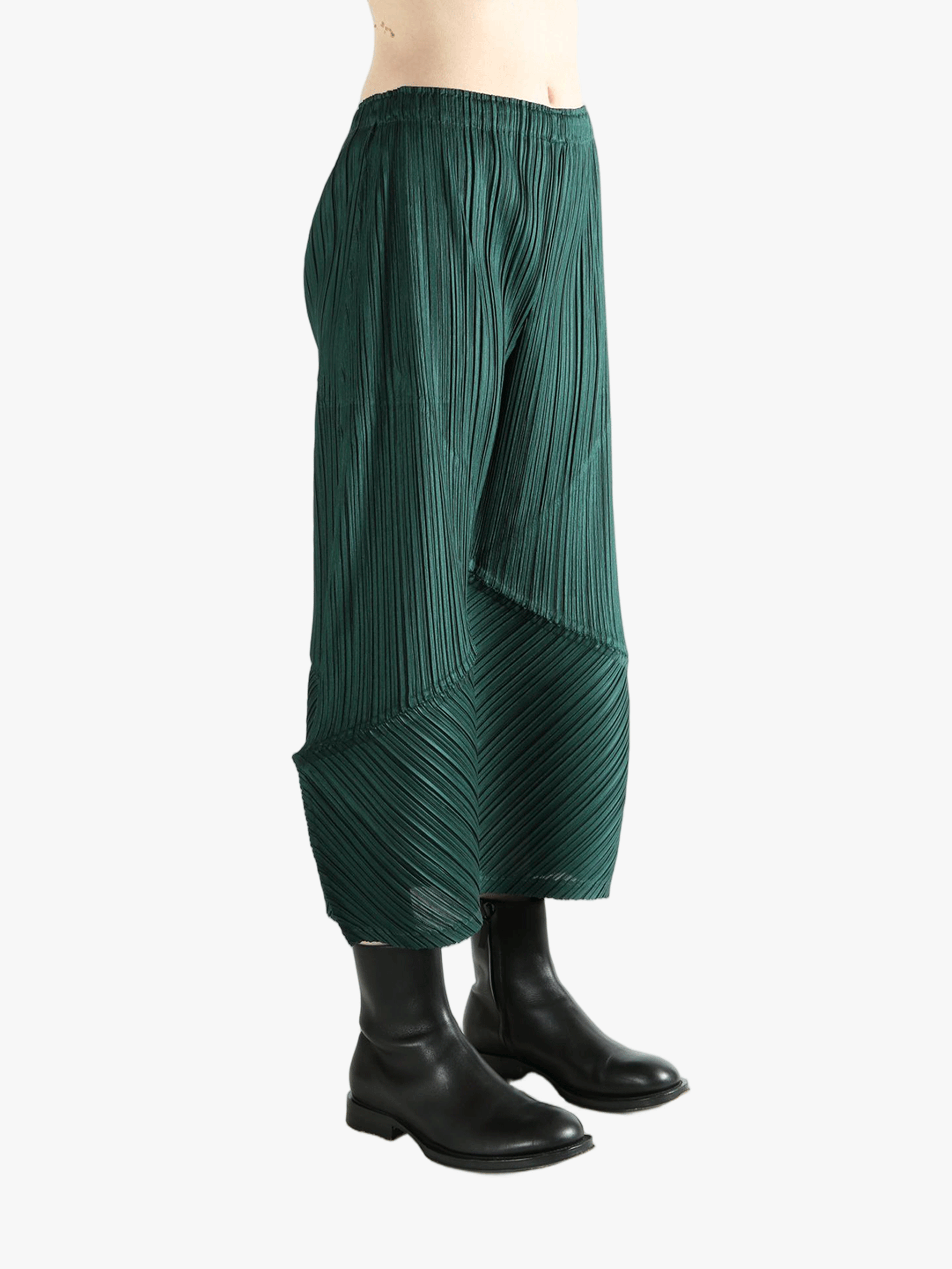 Green pants worn by a person, showing the pants's fit