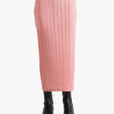Pink skirt worn by a person, showing the  skirt's fit