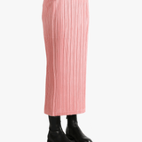 Pink skirt worn by a person, showing the  skirt's fit