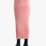 Pink skirt worn by a person, showing the  skirt's fit
