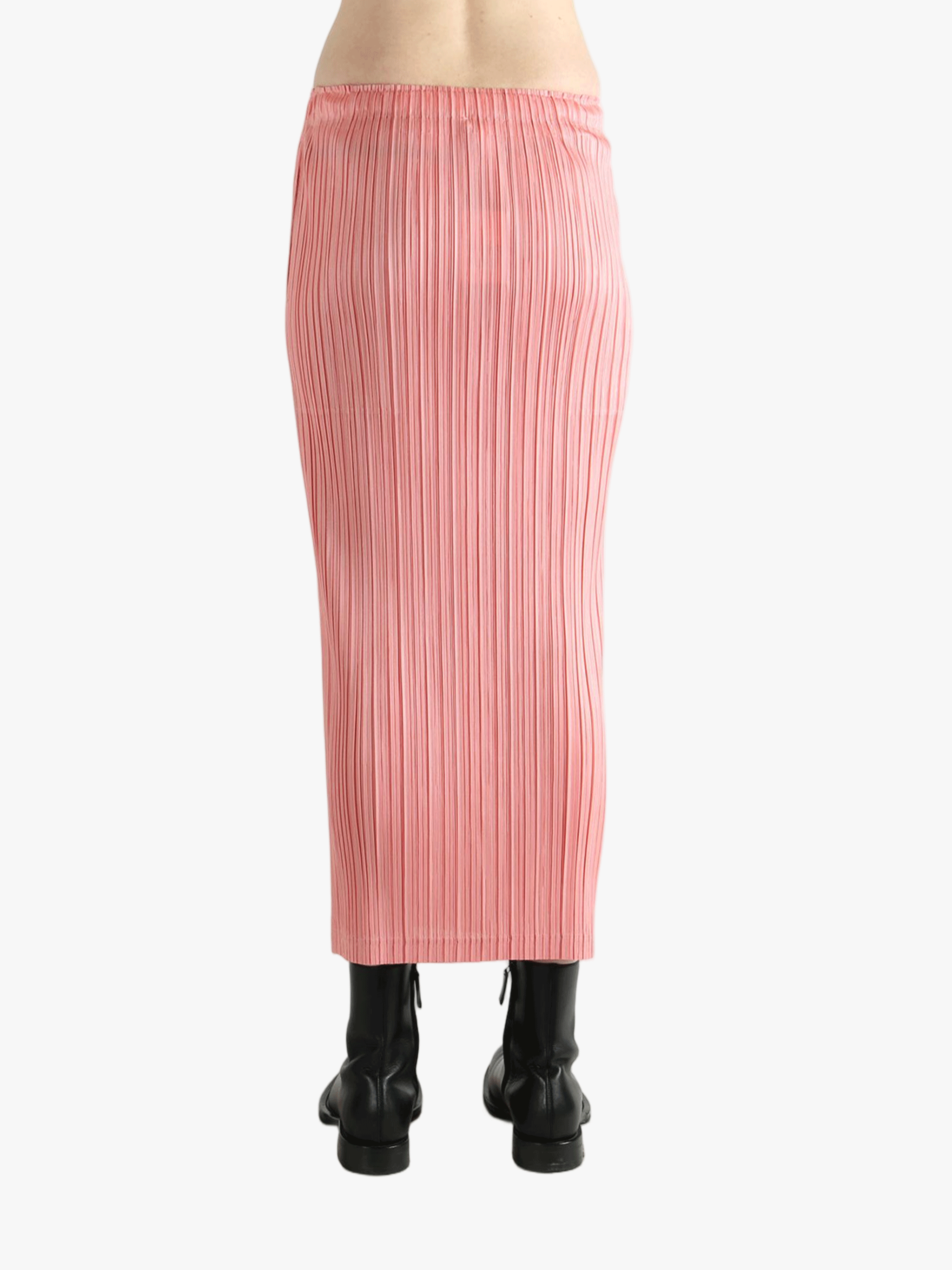 Pink skirt worn by a person, showing the  skirt's fit
