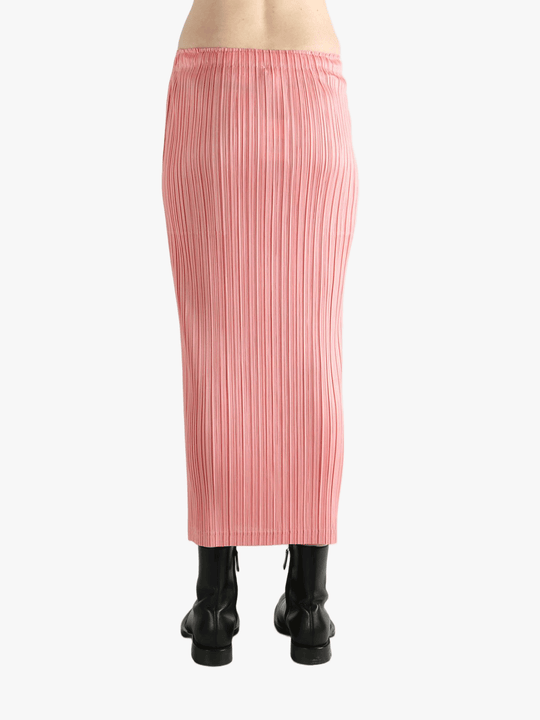 Pink skirt worn by a person, showing the  skirt's fit