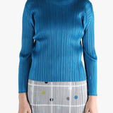 Blue top  worn by a person, showing the top 's fit