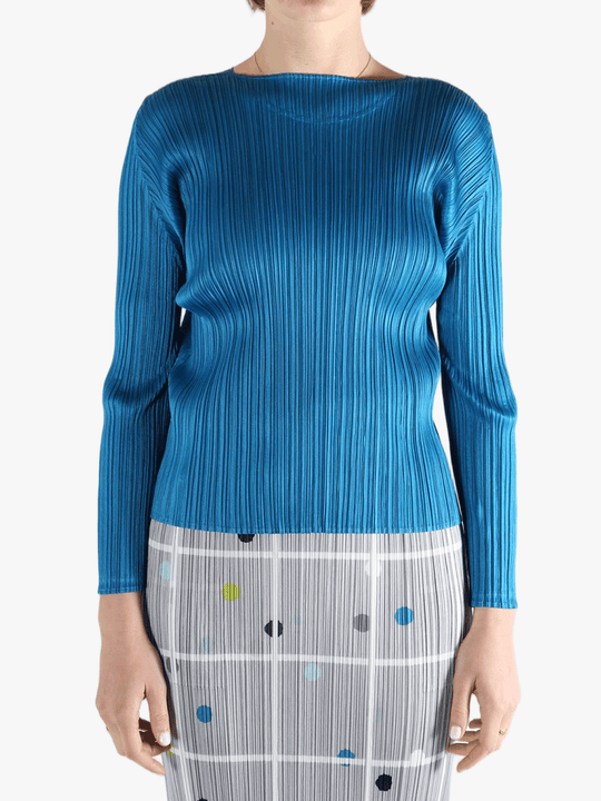 Blue top  worn by a person, showing the top 's fit