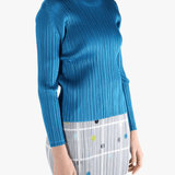 Blue top  worn by a person, showing the top 's fit