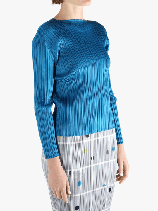 Blue top  worn by a person, showing the top 's fit