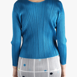 Blue top  worn by a person, showing the top 's fit