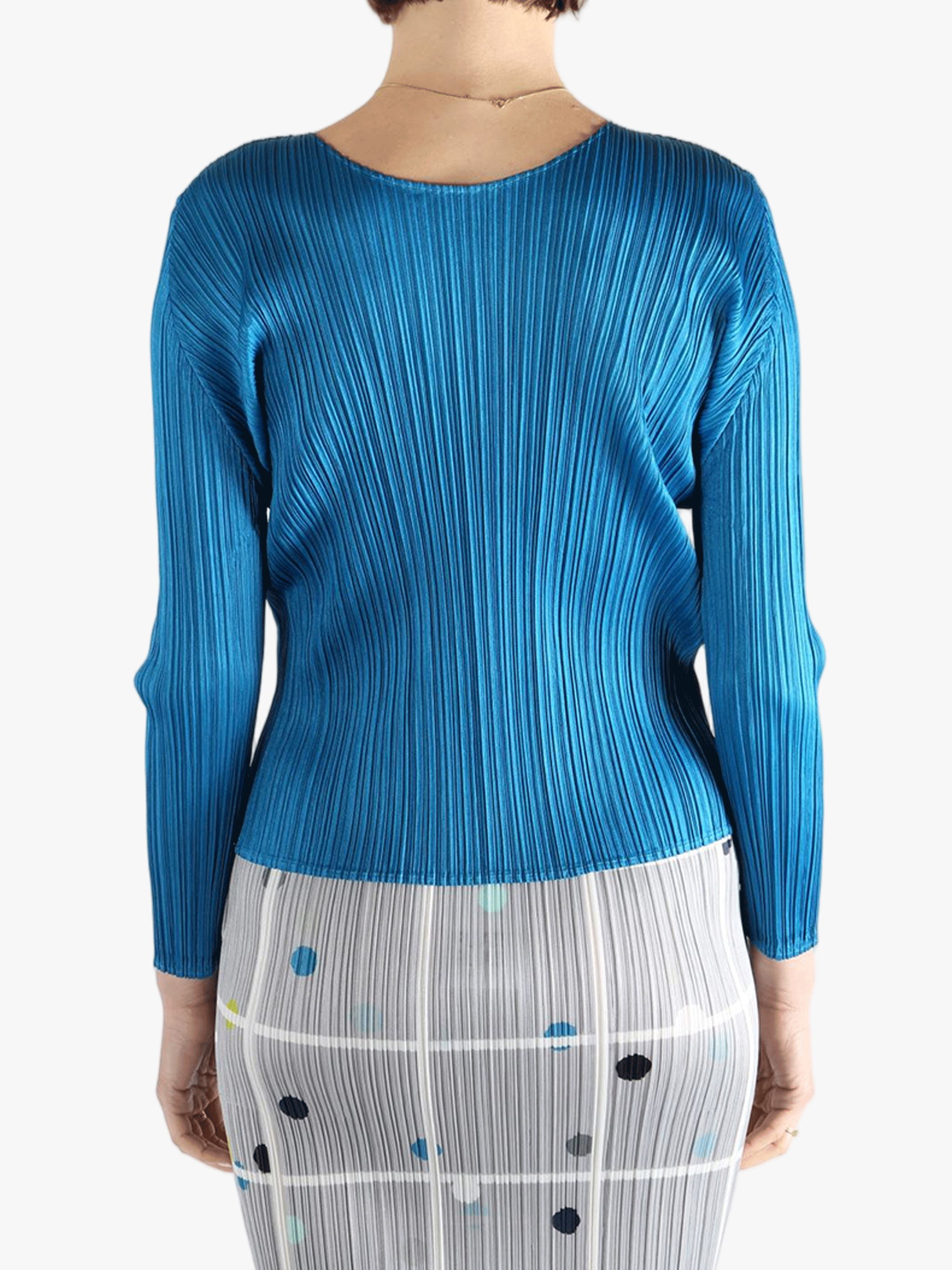 Blue top  worn by a person, showing the top 's fit