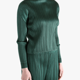 Green shirt worn by a person, showing the shirt's fit