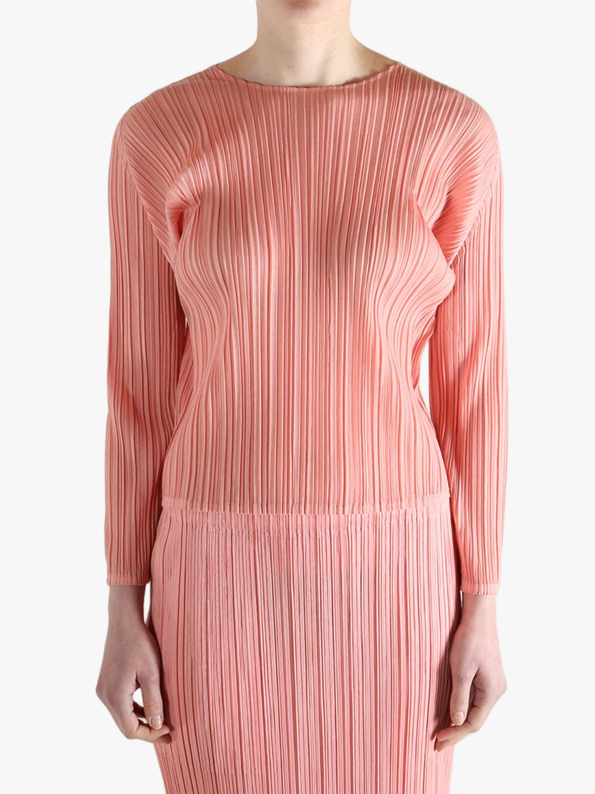 Pink shirt worn by a person, showing the shirt's fit